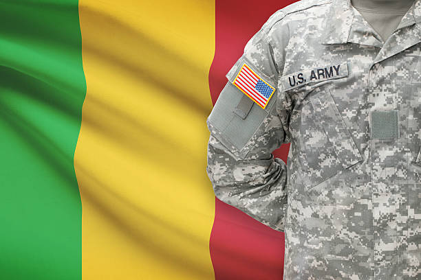istock American soldier with flag on background - Mali 535478687
