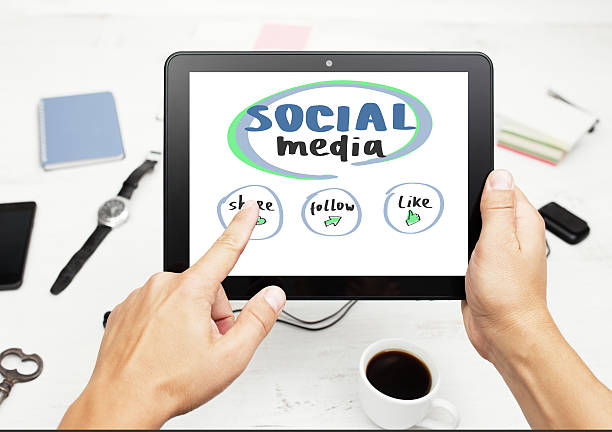 istock Man working on tablet pc with social media concept 535479479