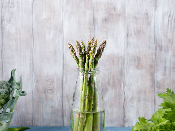 Closeup of organic asparagus in a bottle