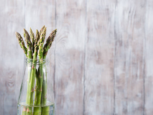 Closeup of organic asparagus in a bottle
