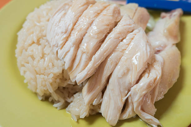 Chicken rice in Singapore Tian Tian Hainanese chicken rice the best chicken rice hawker stall in Maxwell food centre. chinese ethnicity china restaurant eating stock pictures, royalty-free photos & images