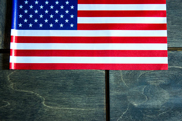 istock American flag on a wooden background 535482436