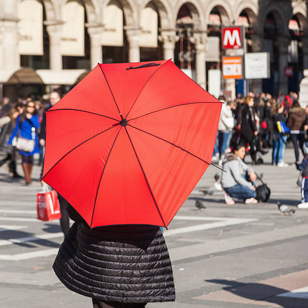 istock woman with a red umbrella in Milan 535482577