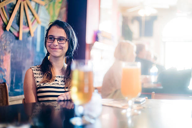 Teenager girl eats in cafe, Charleston, South Carolina