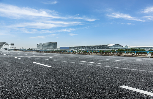 road near by the airport under the blue sky