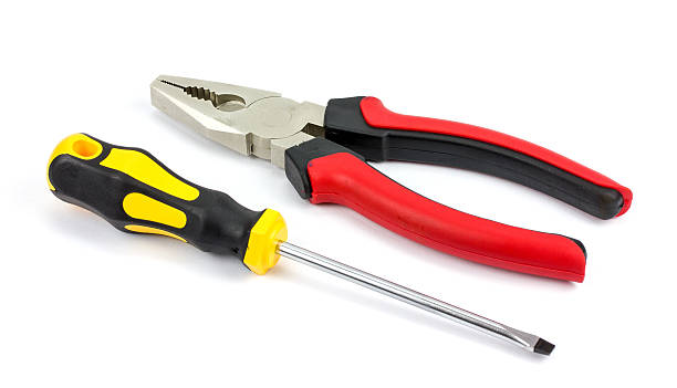 istock screwdriver and pliers on a white background 535485082