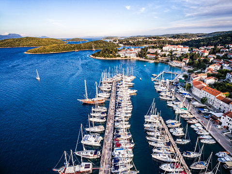 Aerial view on Korcula town with marina and moored sailboats and yachts. Island Korcula, Dalmatia, Croatia. Shot from a drone Phantom 3 Professional. http://santoriniphoto.com/Template-Sailing.jpg
