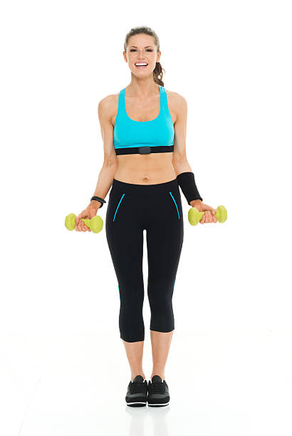istock Sportswoman lifting dumbbells 535487480