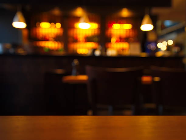 istock blur table top with night club at night 535488702