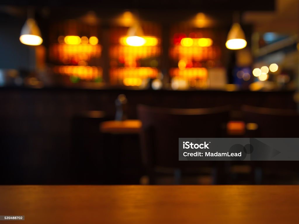 blur table top with night club at night blur table top with night club at night background Bar - Drink Establishment Stock Photo