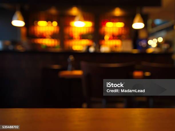 Blur Table Top With Night Club At Night Stock Photo - Download Image Now - Bar - Drink Establishment, Bar Counter, Backgrounds