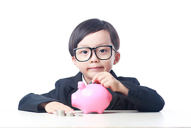 istock Cute child with piggy bank 535489462