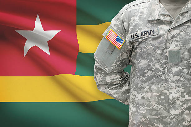 istock American soldier with flag on background - Togo 535490061