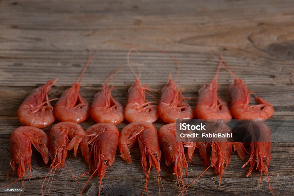 Shrimps Fresh shrimps on wooden tableFresh shrimps on wooden table 2015 Stock Photo