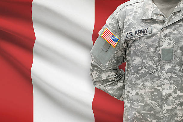 istock American soldier with flag on background - Peru 535493085