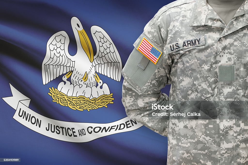 American soldier with US state flag on background - Louisiana 2015 Stock Photo