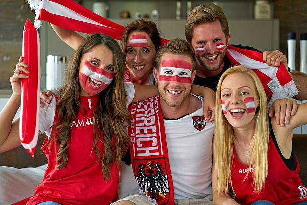 istock austrian soccer fans watching tv 535497032
