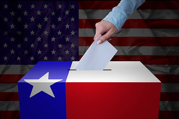 Ballot Box - Election - Texas, USA A hand casting a vote in a ballot box for an election in the Texas, USA dnc stock pictures, royalty-free photos & images