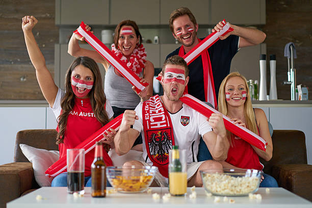istock austrian soccer fans watching tv 535498006