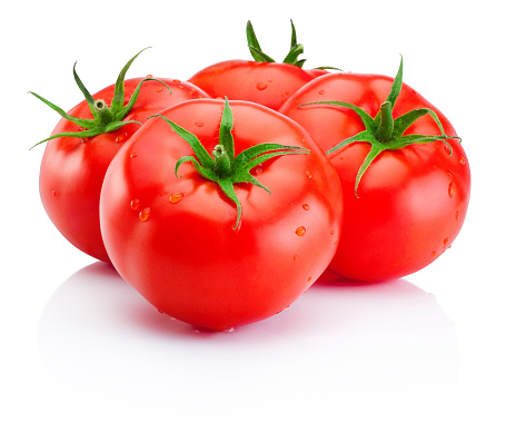 Jugosos tomates rojos maduros aislados sobre fondo blanco photo