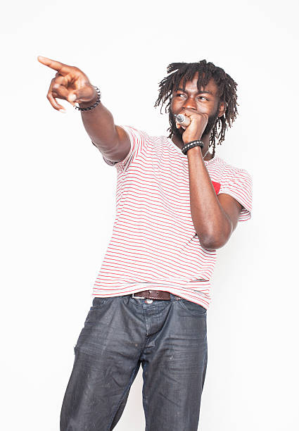 istock young handsome african american boy singing emotional with microphone isolated 535503120
