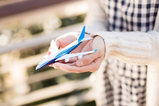 hand girl holding a model airplane, flight, global business
