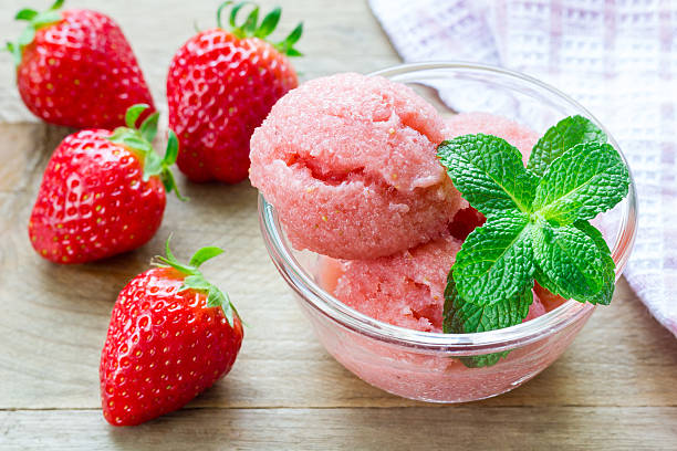 homemade strawberry sorbet in glass, on a wooden table - strawberry portion fruit ripe imagens e fotografias de stock