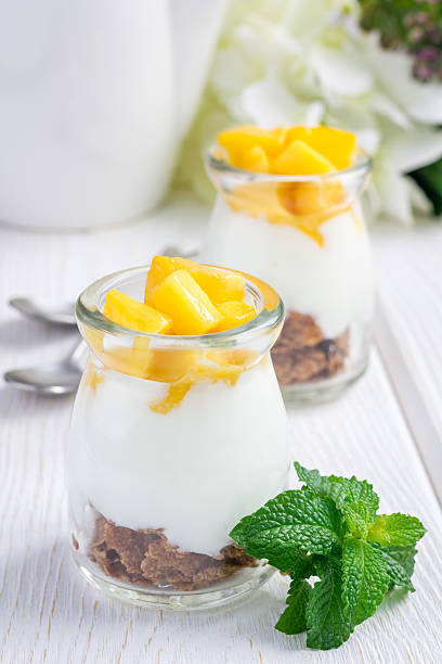 istock Breakfast dessert with bran flakes, plain yogurt and mango 535505868