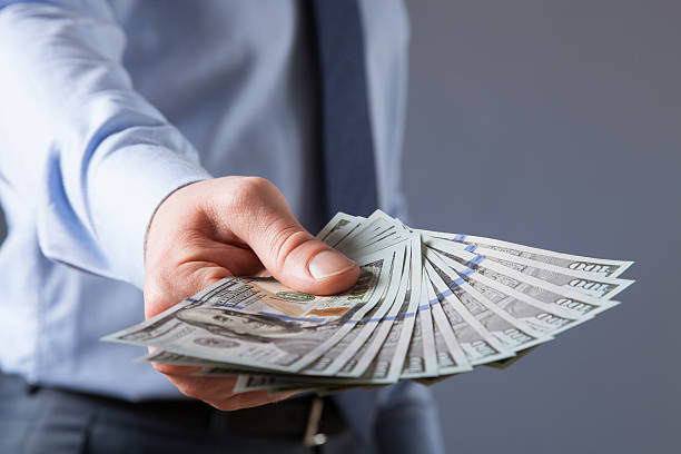 istock Businessman's hand reaching out dollars 535507032