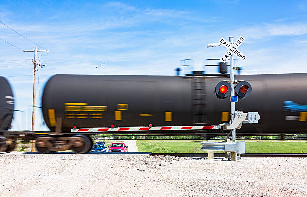 istock Hazardous rail freight passes crossing on rural road. 535509242