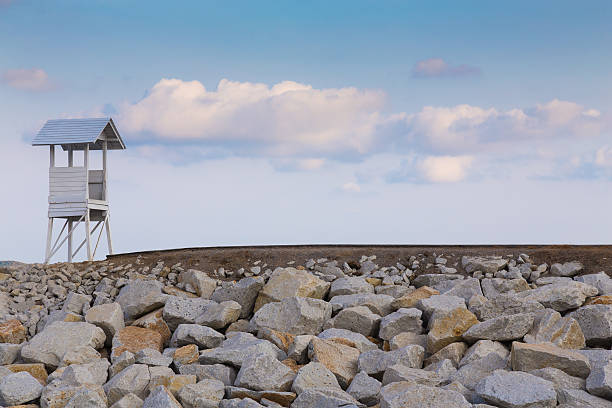 istock Lifeguard tower over the rocky walkway 535511290