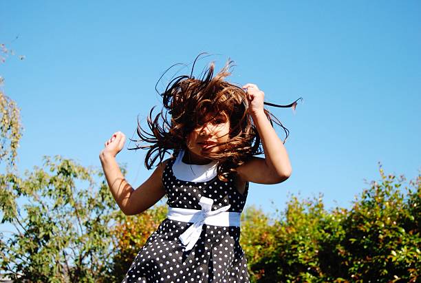 istock Happy girl jumping on trampoline 535511614