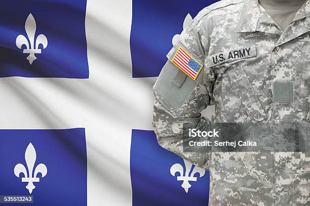 American Soldier With Canadian Province Flag On Background Quebec Stock Photo - Download Image Now