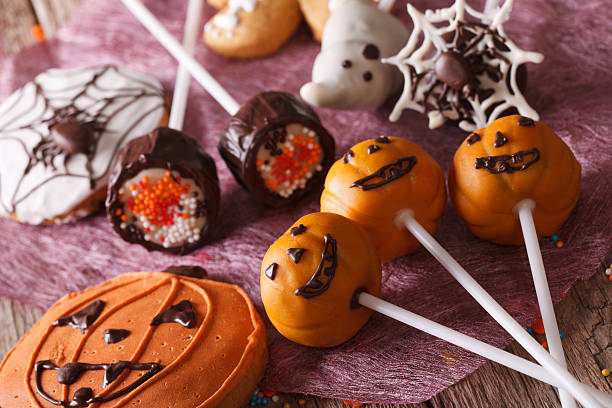 istock Festive Halloween cake pop and gingerbread close-up. horizontal 535513518