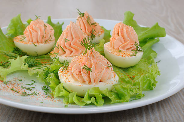 istock Eggs stuffed with salmon pate in lettuce leaves 535513729