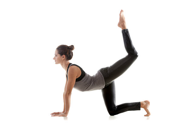 Sporty girl doing rhythmic gymnastics Sporty yoga girl on white background doing exercises for buttocks pics of girls buttocks stock pictures, royalty-free photos & images