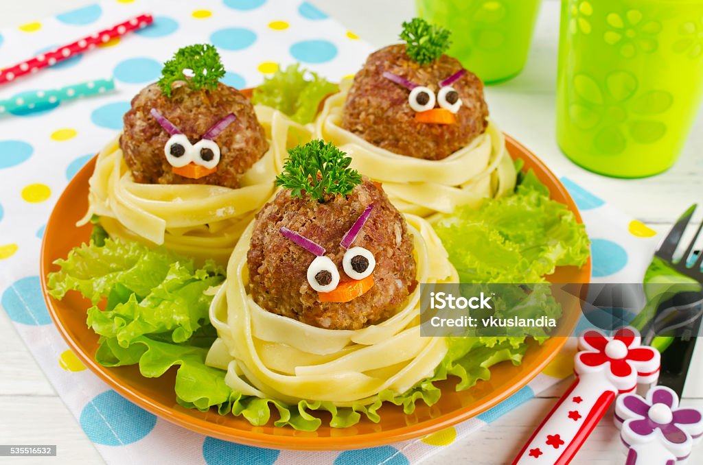 Funny spaghetti with meatballs for kids Funny spaghetti with meatballs for kids. Birds in nests Child Stock Photo