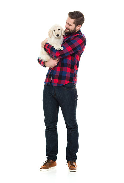 istock Smiling man embracing his dog 535517684