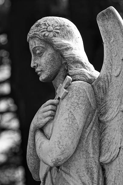istock Beautiful profile statue of the angel praying 535517911