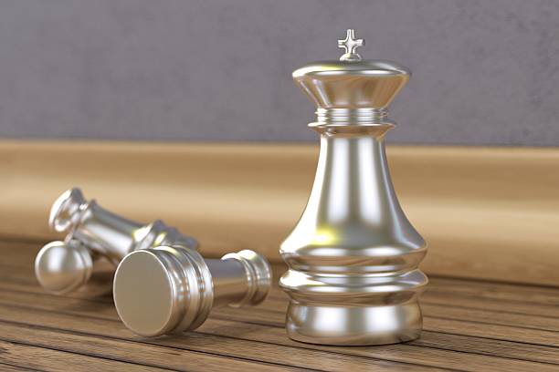 istock Silver chess pieces on wooden floor 535518857