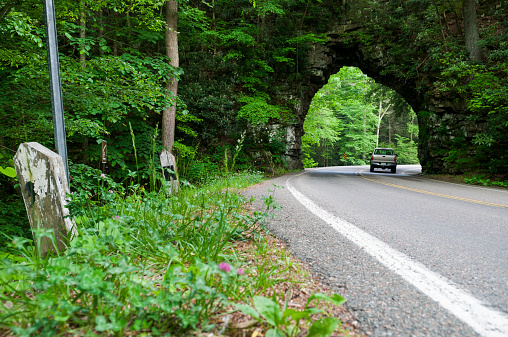 A pick-up truck on Tennessee state highway 133 passes through the tunnel at Backbone Rock Recreation Area in northern Johnson County. Backbone Rock gets its name from a spur ridge on Holston Mountain that abrubtly ends at a bend in Beaverdam Creek.