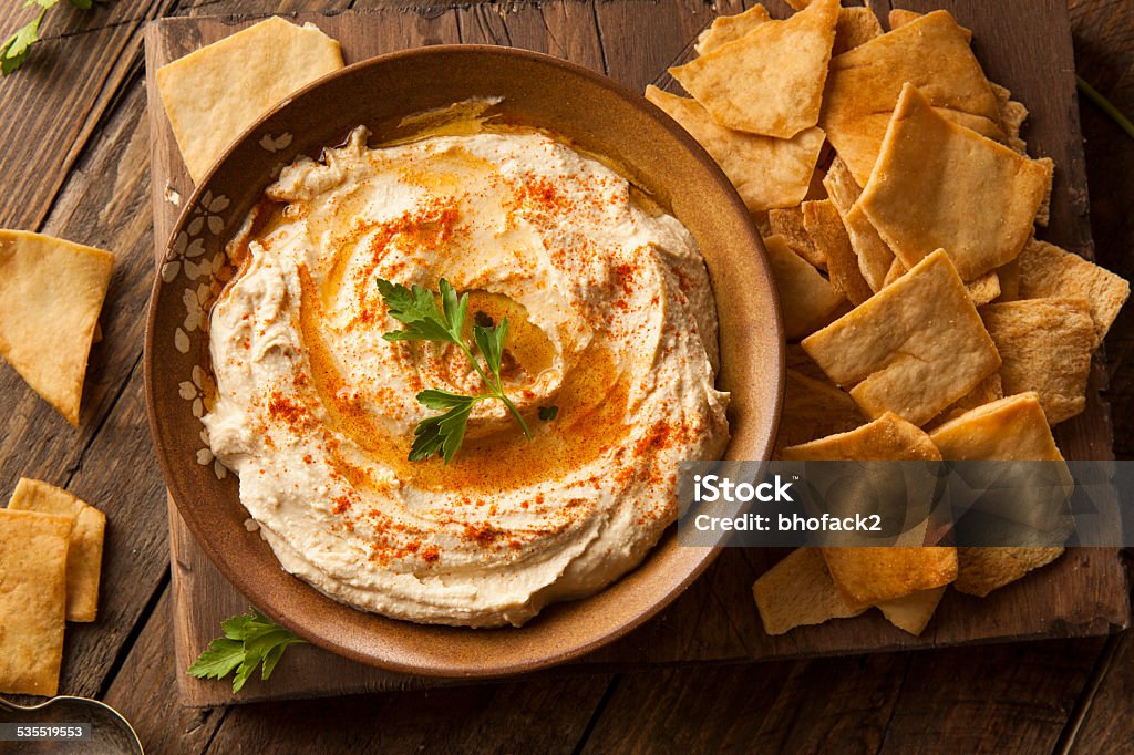 Healthy Homemade Creamy Hummus Healthy Homemade Creamy Hummus with Olive Oil and Pita Chips Hummus - Food Stock Photo