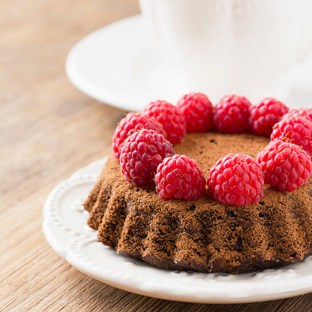 istock Simple homemade chocolate cake with fresh ripe raspberries 535520684