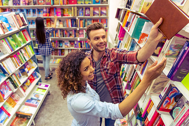istock Young people at the book shop 535521954