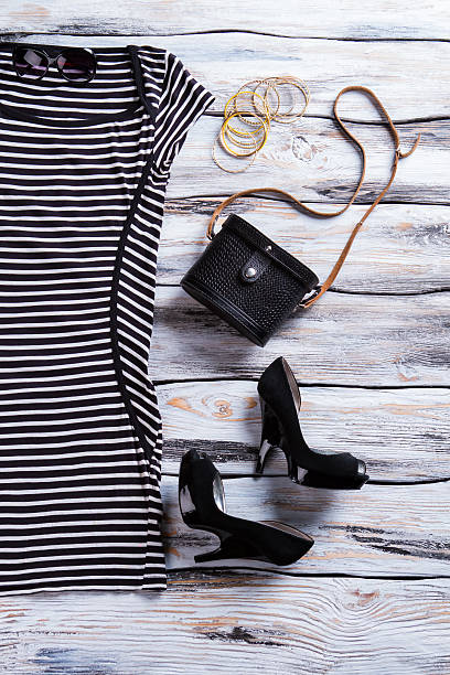 istock Striped black dress and heels. 535522170