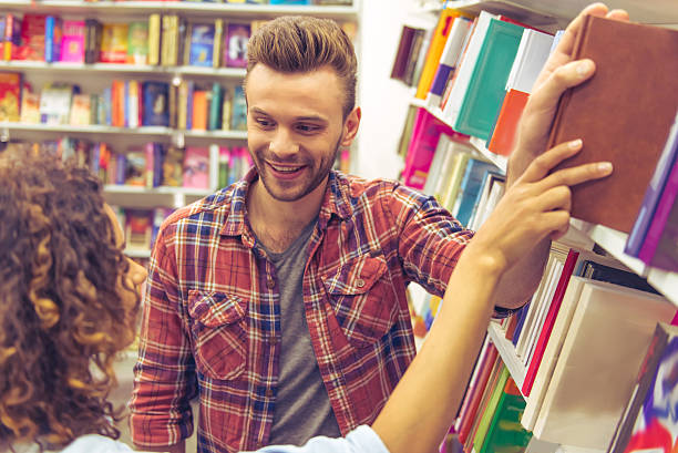 istock Young people at the book shop 535522186