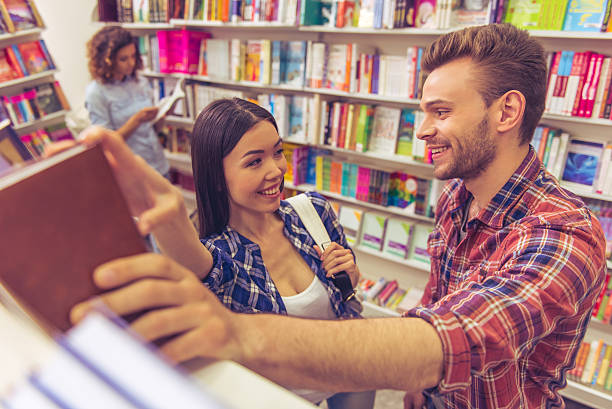 istock Young people at the book shop 535522968