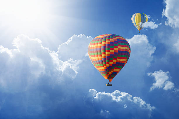 istock Hot air balloons flies in blue sky 535525562