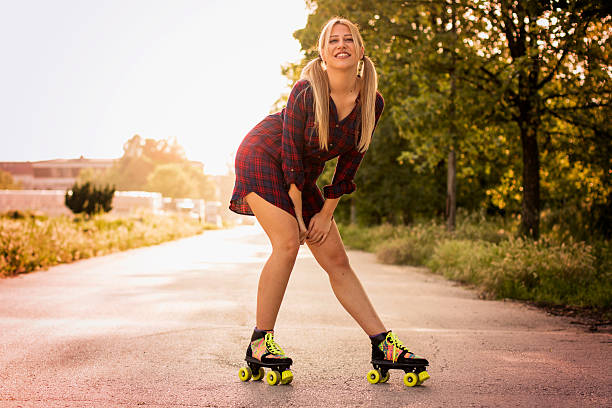 istock Girl roller skating on the road 535527502