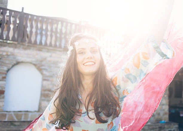 istock Smiling boho woman dancing outdoor 535534322